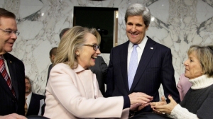 U.S. Secretary of State Clinton and  Sen. Kerry arrive for Kerry's Senate Foreign Relations Committee confirmation hearing on Capitol Hill in Washington